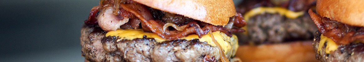 Eating Burger at Lindsey's Cafe and Restaurant restaurant in Lake Worth, FL.